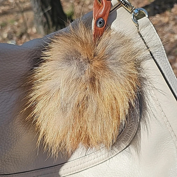 Cole Haan crossbody with fox pom